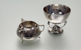 Two Edwardian silver sugar bowls in the Art Nouveau taste: the first with a planished bowl raised on