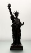 After Bartholdi, patinated bronze table lamp modelled as the Statue of Liberty, early 20th