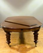 A good Victorian mahogany oval extending dining table with three graduated extra leaves, on heavy