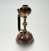 Attributed to Christopher Dresser for Benham & Froud, an Arts & Crafts brass and copper candlestick,