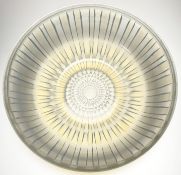 A French opalescent glass bowl, mid-20th century, moulded with a radiating geometric pattern and