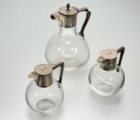 A pair of Victorian silver-mounted cut-glass small carafes, Hukin & Heath, London 1886, of spherical
