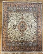 A modern hand knotted Persian Tabriz carpet, the central panel with medallion surrounded by