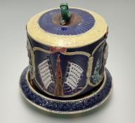 An unusual majolica cheese dome, c. 1880, modelled with portrait busts of Ulysses S. Grant, as