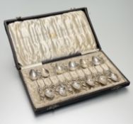 A cased set of twelve Dutch silver coffee spoons, c. 1900, each with stork terminal. (12) Total