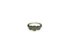 Diamond cluster ring with a triple daisy cluster of brilliant cut diamonds, in 9ct white gold settin