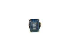 Blue stone cocktail ring in yellow metal setting