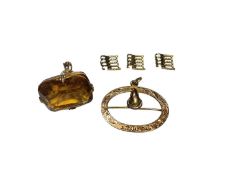 Edwardian 9ct gold mounted citrine fob, Edwardian 9ct gold buckle shaped pendant and three spare yel