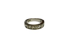 18ct white gold half eternity ring set with seven synthetic white stones