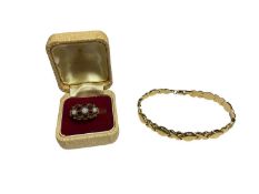 9ct gold ‘xo’ articulated link bracelet and a 9ct gold garnet and opal flower head cluster ring