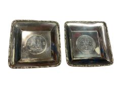 Pair of sterling silver square pin dishes each inset with a Chinese coin, 9cm