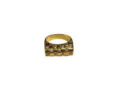 Gold dress ring with chequered design of synthetic white stones