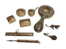 Group of silver pill pots, miniature silver backed mirror, silver propelling toothpick, miniaure sil