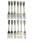 Six Georgian silver dinner forks (London 1824) and six Victorian silver dessert forks (London 1892),