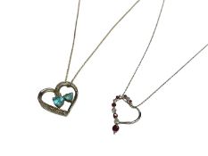 Diamond and ruby 9ct white gold heart pendant on chain and a diamond and blue topaz silver heart sha