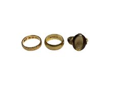 Victorian 18ct gold wedding ring with engraved decoration, 9ct gold wedding ring and a gem set gold