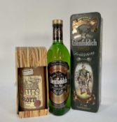 Two bottles, Glenfiddich Pure Malt Scotch Whisky, 75cl., 40%, in Clan Macpherson tin and a bottle of