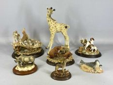 COLLECTION OF COUNTRY ARTISTS ANIMAL FIGURES, RW21 Rhino and baby, CA669 Howling Wolf, medium, 01492