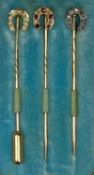 THREE CASED YELLOW METAL GEM SET HORSESHOE STICK PINS, one set with diamonds, one set with