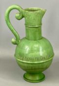 CLAYPITS EWENNY POTTERY CREAM GLAZED JUG, bulbous body incised 'Gur Yr Haiarn Tra Fydo Yn Boeth',
