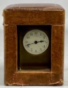 FRENCH LACQUERED BRASS FOUR-GLASS CARRIAGE CLOCK, circular white enamel dial with Arabic numerals,