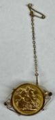 GEORGE V 1911 GOLD FULL SOVEREIGN in 9ct gold brooch mount with safety chain, 10.6gms gross