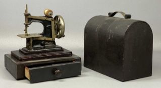 ANTIQUE 'BABY' HAND SEWING MACHINE, on wooden plinth with drawer, under ply dome, 27cms (h)