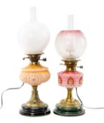 TWO GLASS, BRASS & POTTERY OIL LAMPS, both with moulded reservoirs, one with plain opaque glass