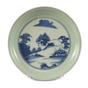 JAPANESE ARITA BLUE & WHITE SAUCER DISH, 18th Century, centre painted with landscape within