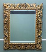 GILTWOOD FLORENTINE STYLE FRAMED MIRROR, fitted with later bevelled mirror plate, 102 (h) x 85cms (