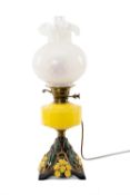 ATTRACTIVE YELLOW & CAST METAL OIL LAMP with opaque glass shade and funnel, base with floral