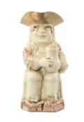 LATE 18TH C. WOOD FAMILY TYPE CREAMWARE TOBY JUG, seated figure with oversized baluster jug of