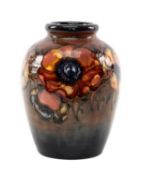 EARLY WILLIAM MOORCROFT POPPY PATTERN OVIFORM VASE, base with applied paper label, impressed