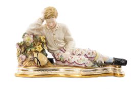 19TH c. JOHN BEVINGTON RECLINING CHINA FIGURE, of youth beside stump with book and flask, on