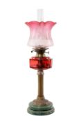 CRANBERRY GLASS, COPPER & GREEN POTTERY OIL LAMP, 60cms (h) to top of shade Provenance: private