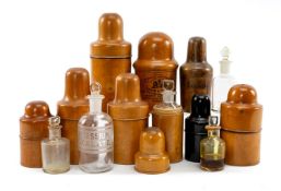 COLLECTION OF PHARMACY CASED BOTTLES, including one in boxwood stamped Unwin & Albert (Court Head