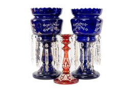 PAIR OF EDWARDIAN ENAMELLED BLUE GLASS TABLE LUSTRES, with gilt decoration and cut glass prismatic