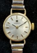 TISSOT 9CT GOLD CASED LADIES' WRISTWATCH, circular case with champagne dial, baton hour markers,