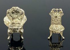 TWO EDWARDIAN SILVER MINIATURE CHAIRS, an ornate saloon chair, George Burrows, London 1909, 930
