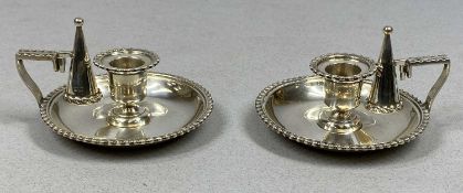 PAIR OF EDWARD VII SILVER CHAMBER STICKS, with gadrooned decoration, detachable nozzles and matching