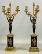 PAIR OF EMPIRE STYLE FIGURAL THREE-BRANCH CANDELABRA, ormolu and patinated bronze, with central