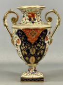 DERBY TWO-HANDLED OVOID PEDESTAL VASE, c. 1820, painted in Imari colours with gilded highlights,