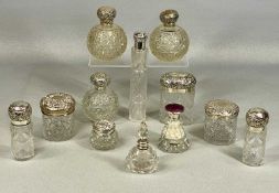 GOOD COLLECTION OF CUT GLASS DRESSING TABLE JARS and scent bottles with silver covers (12)