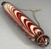 NAILSEA TYPE RED & CLEAR GLASS ROLLING PIN, 37.5cms (l) Provenance: The Cornelia Bayley Collection