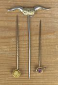 THREE GOLD / YELLOW & WHITE METAL STICK PINS, comprising 9ct gold and amethyst Edwardian design,