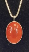 SILVER PENDANT & CHAIN, with red carnelian cabochon stone and long silver box link chain, maker '