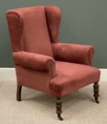 A VINTAGE WINGBACK ARMCHAIR, red upholstered, on turned supports and castors, 101 (h) x 81 (w) x