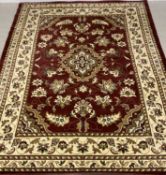MODERN RUG, labelled 'Sherbourne Sincerity', with burgundy ground and central floral pattern, 330