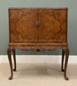 REGENCY STYLE BURR WALNUT COCKTAIL CABINET, with fitted and mirrored interior, carved apron, on