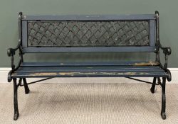 A WOODEN SLATTED GARDEN BENCH having cast iron ends and lattice back, 78 (h) x 128 (w) x 82cms (d)